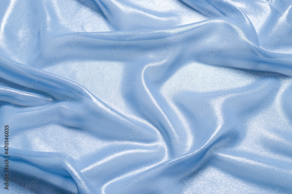 Blue shiny pearl fabric as a background. Blue shiny pearl fabric as a background.