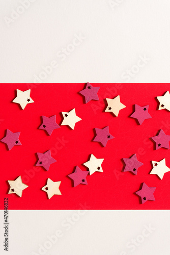 wooden star shapes on red pape