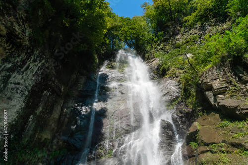 Mahuntseti Waterfall on a sunny, bright day. Georgia. Sights of Georgia photo