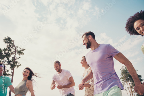 Photo of relaxed inspired friends people spend weekend free time wear casual outfit nature summer seaside beach #470148048