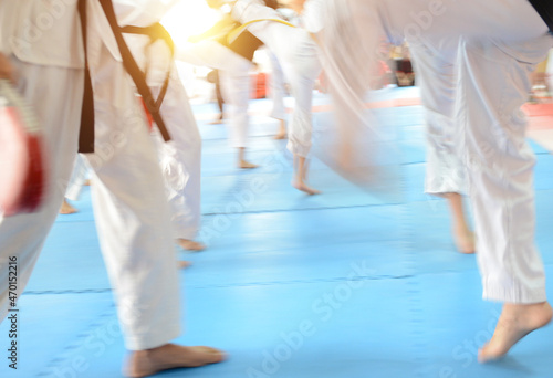 People in martial arts training exercising Taekwondo. blur motion