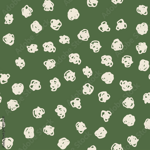 Polka dot beige abstract seamless pattern on green background. Vector design for textile, backgrounds, clothes, wrapping paper, web sites and wallpaper. Fashion illustration seamless pattern.