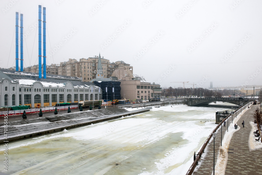 View of the Moskva River and Bolotnaya embankment on a foggy winter morning. Foggy winter morning in Moscow.