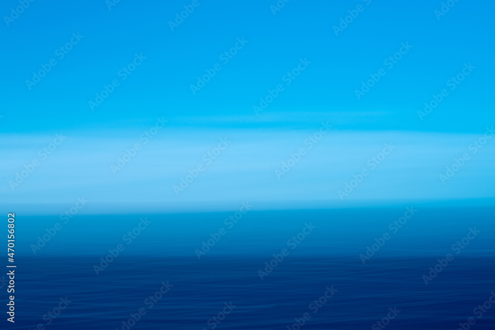 Sky clouds and the Pacific Ocean merge into one image. Sky clouds and the Pacific Ocean merge into one image.