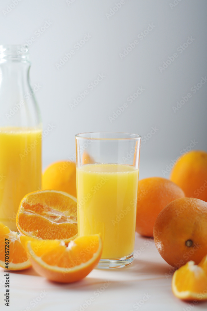 Oranges and orange juice in glasses Oranges and orange juice in glasses