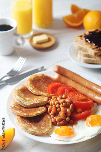 Traditional British breakfast with sausages and beans 
