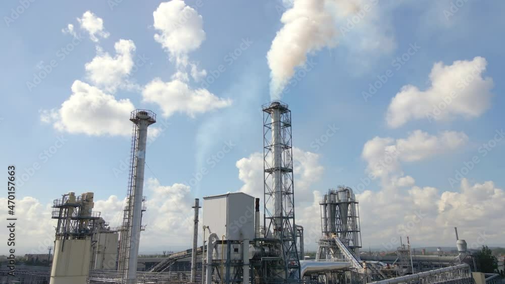Aerial view of factory with high plant manufacture structure. Global production and manufacturing concept Aerial view of factory with high plant manufacture structure. Global production and manufacturing concept