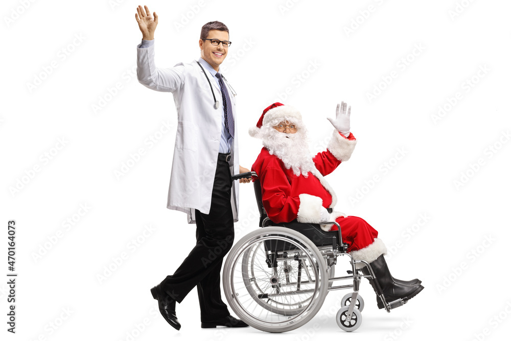 Full length profile shot of a doctor pushing santa claus in a wheelchair and waving at camera Full length profile shot of a doctor pushing santa claus in a wheelchair and waving at camera