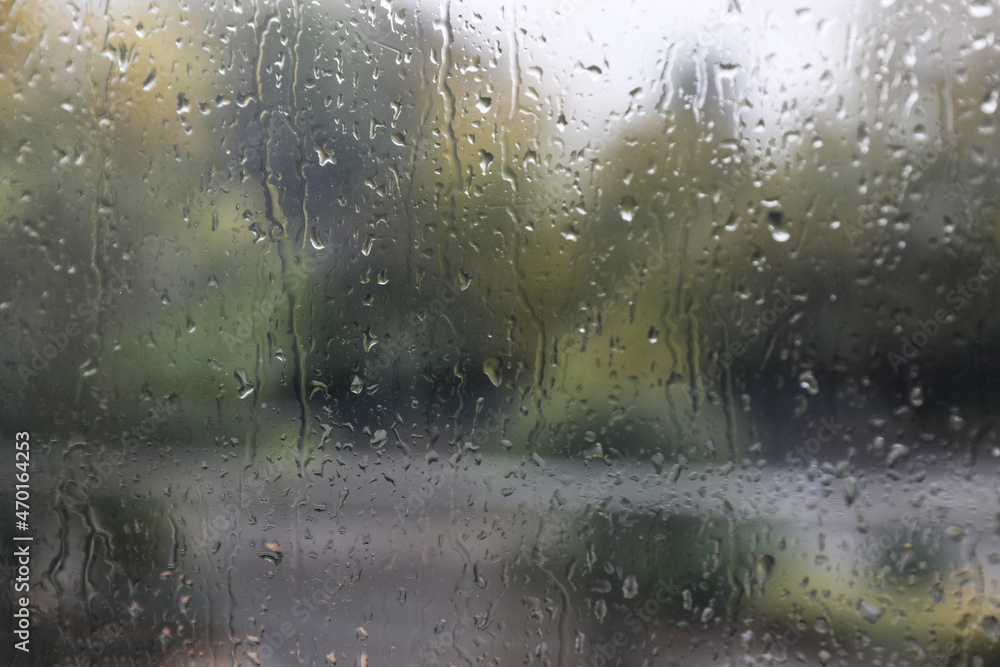 Window glass with water drops, closeup. Rainy weather Window glass with water drops, closeup. Rainy weather
