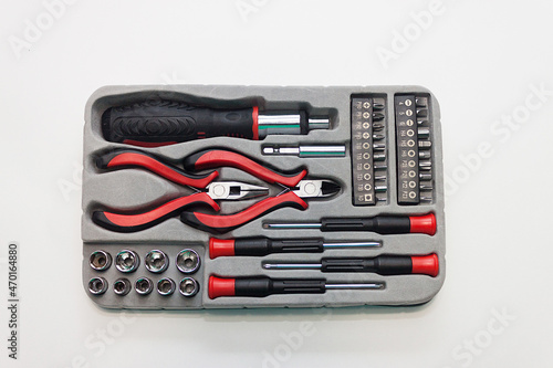 Universal screwdriver set with replaceable bits on a light background.