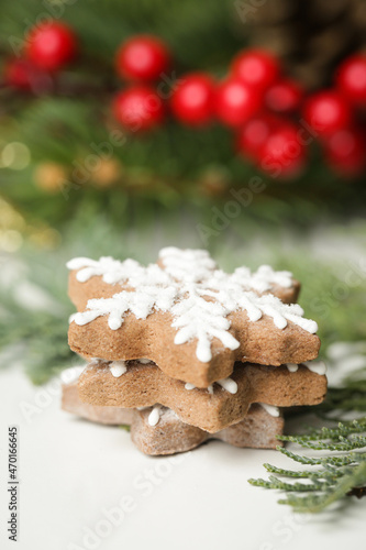 Fototapeta Naklejka Na Ścianę i Meble -  Christmas decoration. Christmas tree branches and homemade decorated Christmas cookies, close up image.