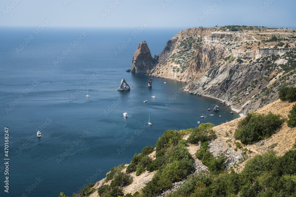 Fototapeta premium Fiolent , Crimea - sea landscape. Sea view - Mountains surround the bay and the small pleasure yacht boats moored in the lagoon
