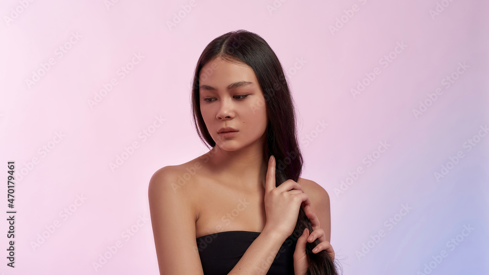 Obraz premium Beautiful young Asian woman touch healthy thick hair