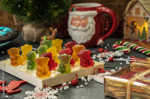 composition of christmas sweets and a cup of coffee on a wooden background