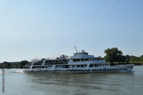 River boat transporting passenger on Danube river between Tulcea and Sulina photo