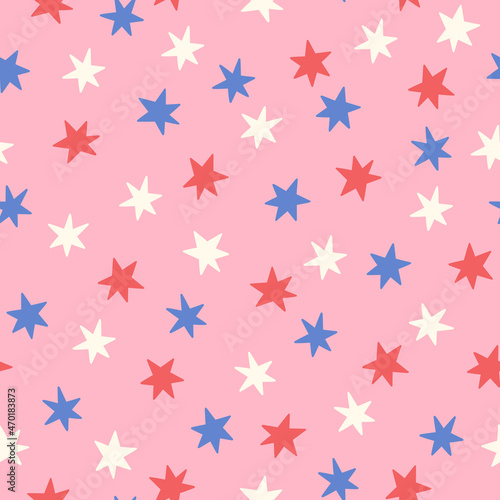 Blue, red and white stars on pink seamless pattern