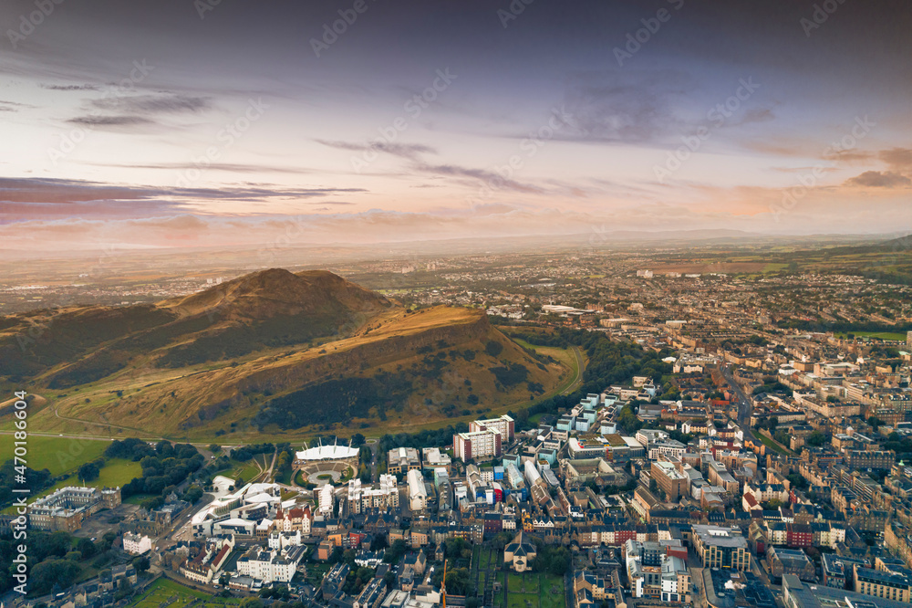 Aerial view of Edinburgh in the morning sunrise. Great view from the top of Arthur's Seat. From here, I could look down on the entire city, capturing the morning sunrise at the very start of a new day