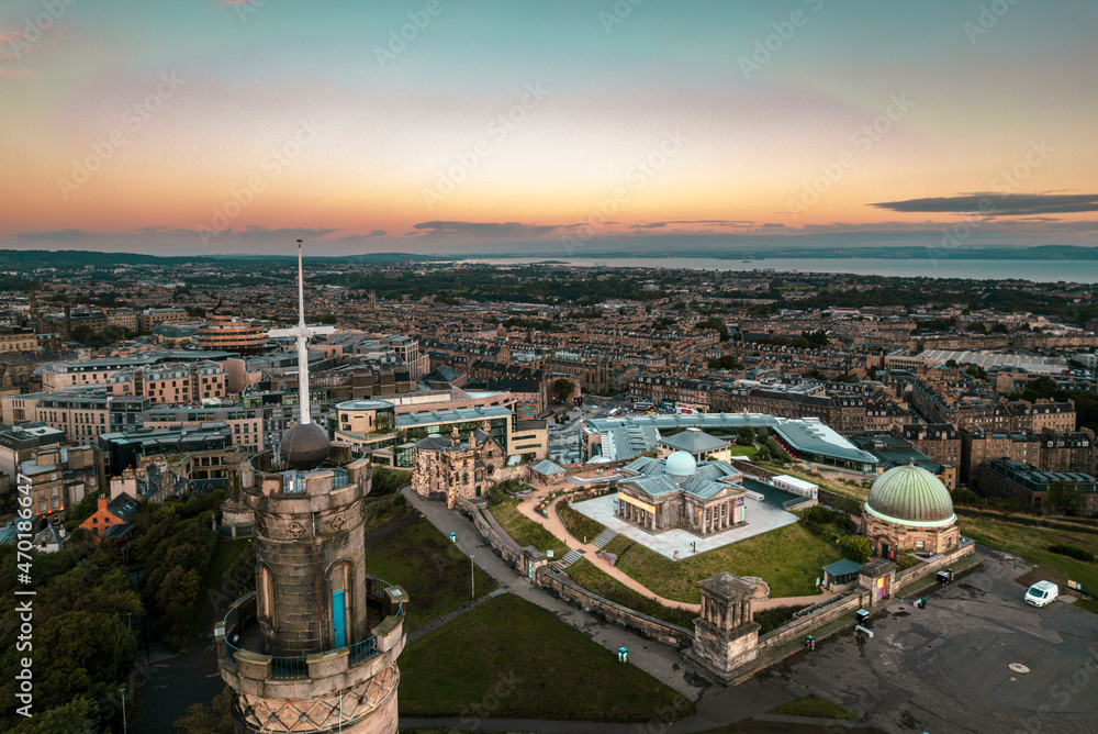 Calton Hill, Edinburgh, Scotland amazing sunrise aerial view of Nelson Monument made of bronze and one of the most important landmarks in Calton Hill. Stunning view of Edinburgh old town