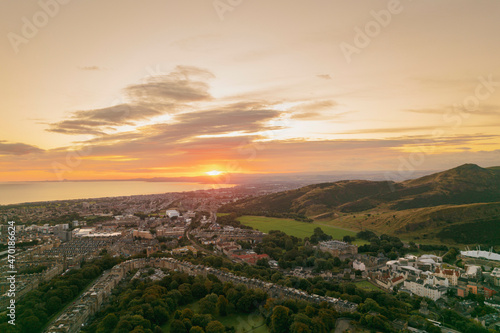 Aerial view of sunrise Edinburgh's largest park offers so much for visitors, climb to Arthur's Seat for stunning views of the city, explore the castle where Scottish kings lived or visit museums © Damian