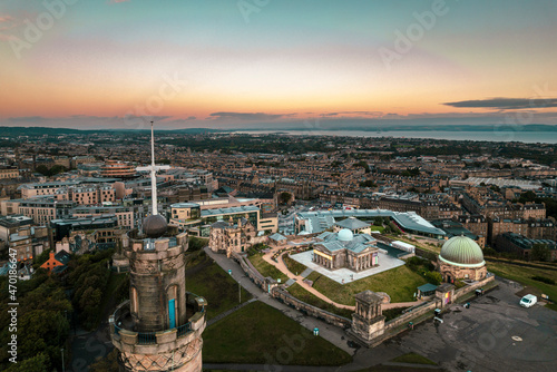 Calton Hill, Edinburgh, Scotland amazing sunrise aerial view of Nelson Monument made of bronze and one of the most important landmarks in Calton Hill. Stunning view of Edinburgh old town