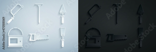 Set Hand saw, Trowel, Paint bucket, Putty knife, Metallic nail and Hacksaw icon. Vector