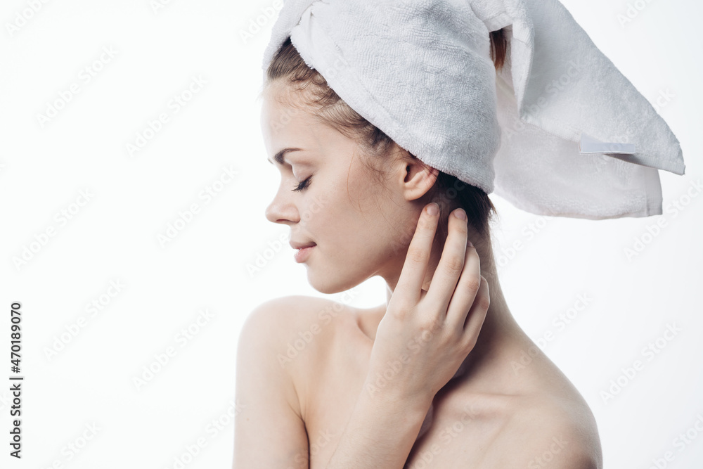 woman after shower with towel on head posing skin care woman after shower with towel on head posing skin care