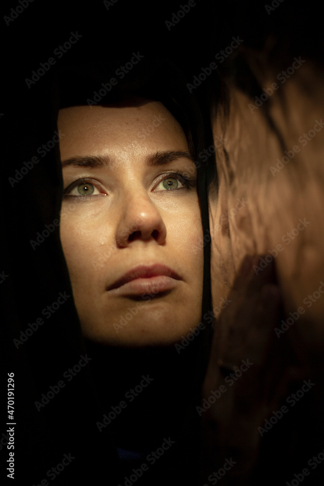 Portrait of a young woman in the shade close up Portrait of a young woman in the shade close up