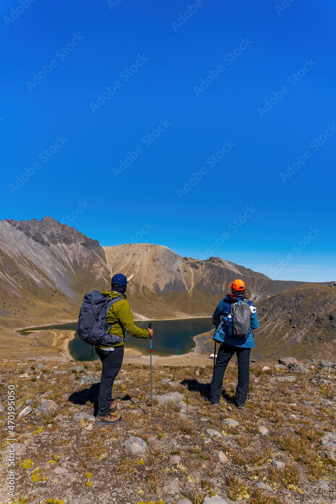 Couple Trekking on the natural landscape. Hiking man and woman