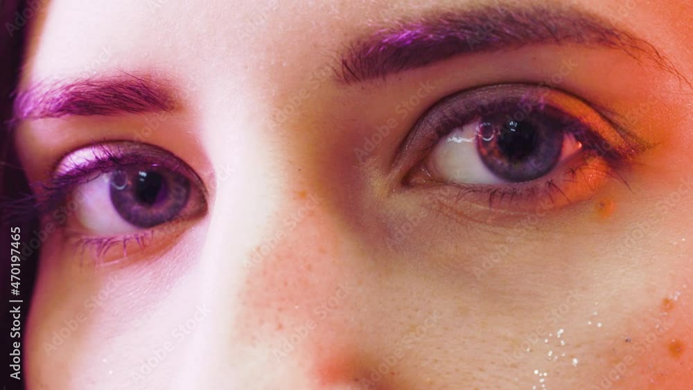 Girl look into the camera close-up Girl look into the camera close-up