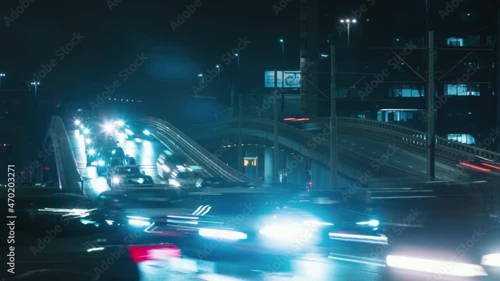 Time lapse traffic jam overpass road at night, roadway in modern big city in evening. Timelapse busy town highway. Cars rush hour drive way, car lights trail in fast motion. Urban life, transportation Time lapse traffic jam overpass road at night, roadway in modern big city in evening. Timelapse busy town highway. Cars rush hour drive way, car lights trail in fast motion. Urban life, transportation