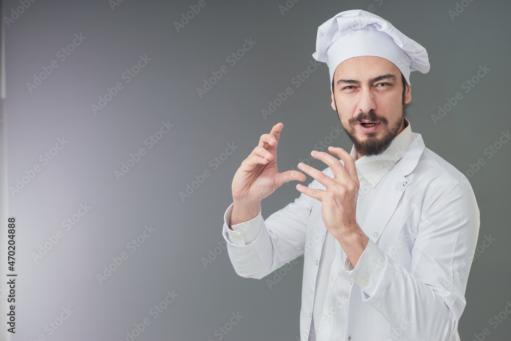 Amazed young male Italian handsome chef. He is Gesturing delicious sign, studio shot includes copy space. Amazed young male Italian handsome chef. He is Gesturing delicious sign, studio shot includes copy space.