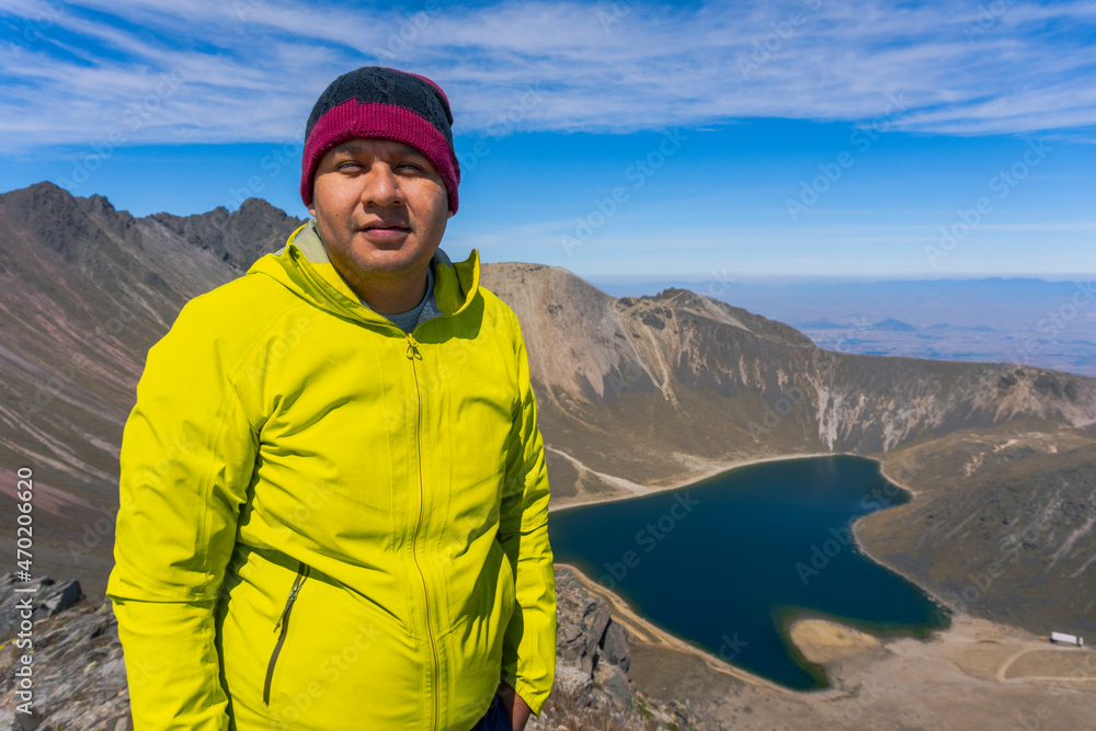 Hiker overlooking lake in mountains