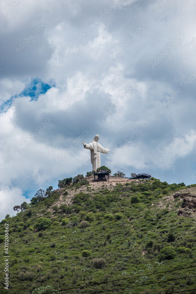 View of Cristo Jesus statue on top of a hill on a cloudy day in Cochabamba Bolivia South America
