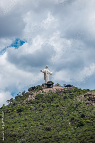 View of Cristo Jesus statue on top of a hill on a cloudy day in Cochabamba Bolivia South America