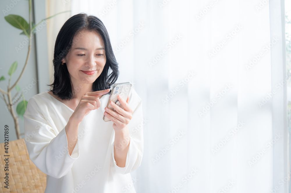 Zoom of a beautiful Asian (Japanese woman) you see tapping on your phone. Copy space available. Zoom of a beautiful Asian (Japanese woman) you see tapping on your phone. Copy space available.