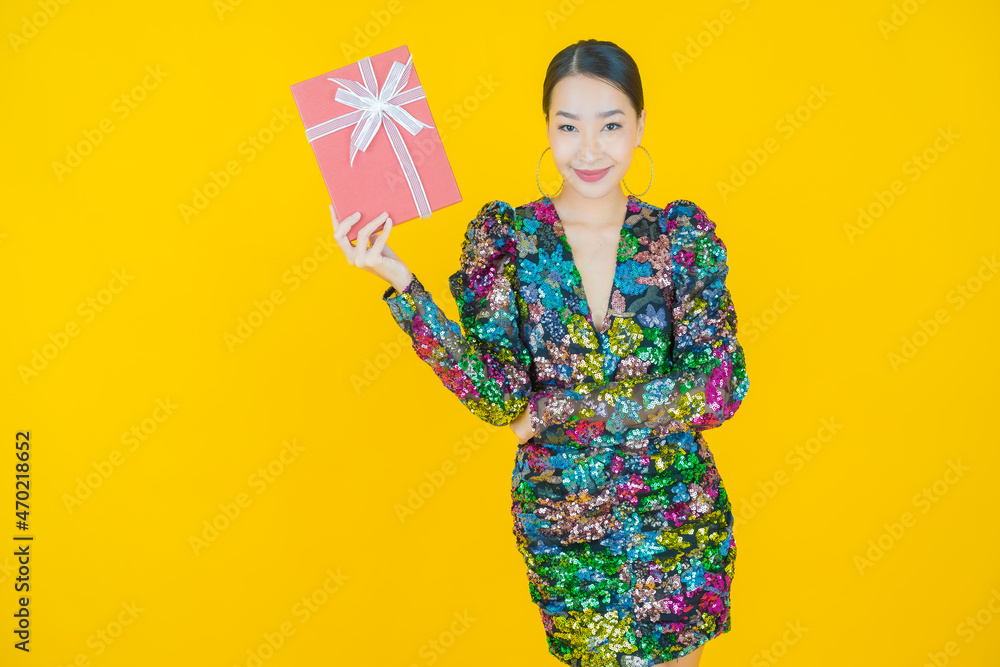 Portrait beautiful young asian woman smile with red gift box Portrait beautiful young asian woman smile with red gift box