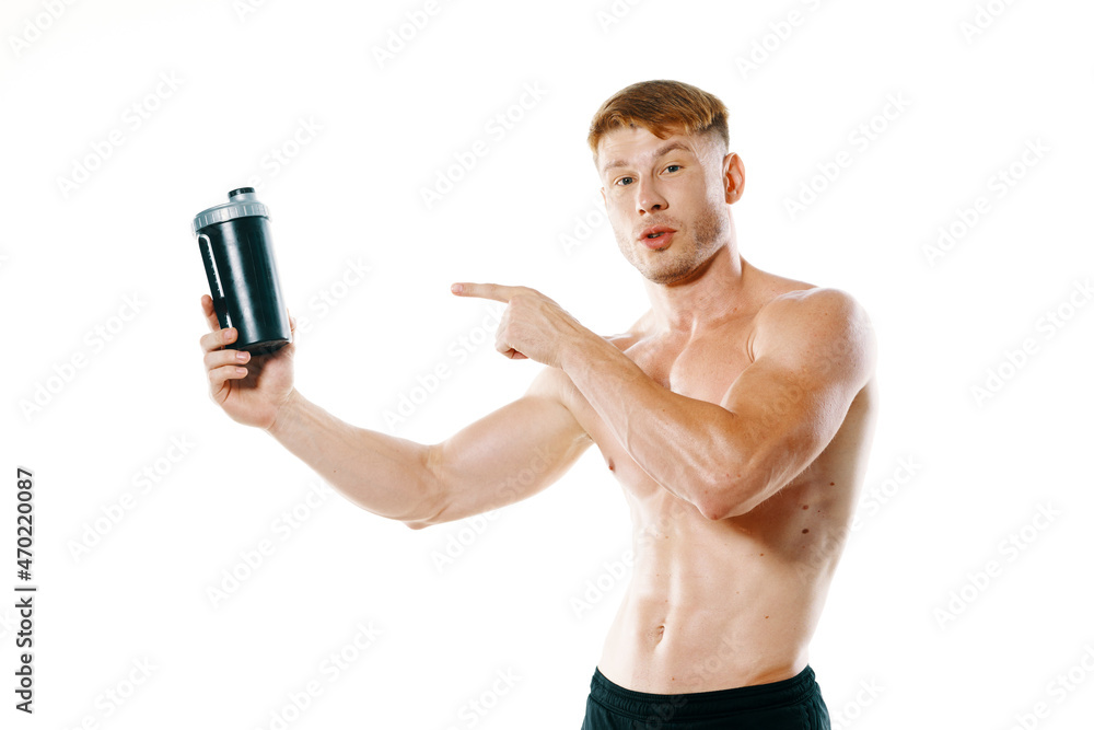 Fototapeta premium athletic man with a pumped-up torso drink bottle sportspit