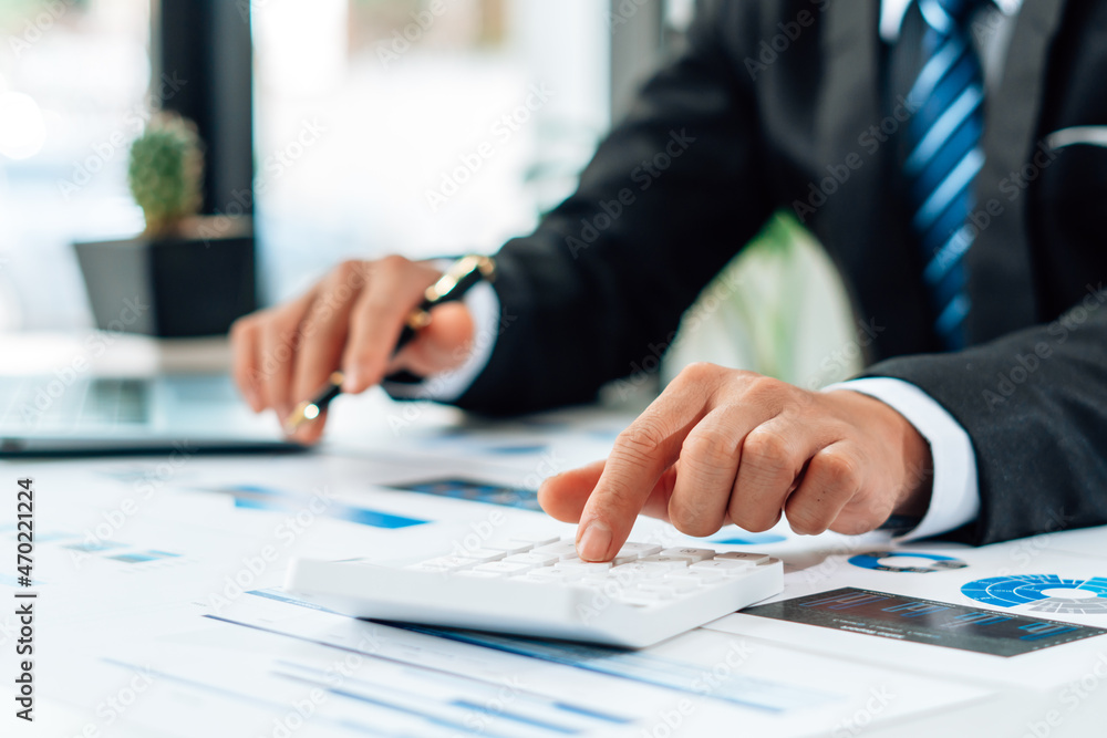 Close up view of bookkeeper or financial inspector hands making report, calculating or checking balance. Home finances, investment, economy, saving money or insurance concept. Close up view of bookkeeper or financial inspector hands making report, calculating or checking balance. Home finances, investment, economy, saving money or insurance concept.