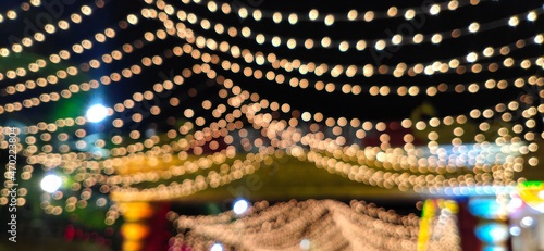 Blurred Bokeh Background of Glittering Golden serial lights abstract. Entrance. Shining.