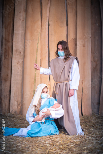 Nativity scene with the characters wearing facial masks