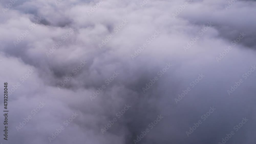 Time lapse cloud fog over sky ,Aerial view above the clouds and sky in morning time , Flight above the clouds concept Time lapse cloud fog over sky ,Aerial view above the clouds and sky in morning time , Flight above the clouds concept