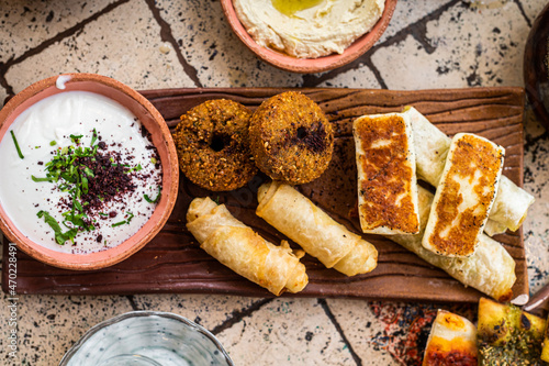 Fried cheese and falafel with sause in Turkish Village Breakfast. Top view