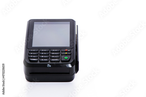 black payment terminal close-up for accepting money from plastic cards from customers on a white isolated background, copy space