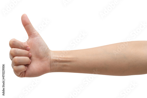 Woman hand showing thumbs up sign isolated on white background. © Pataradon