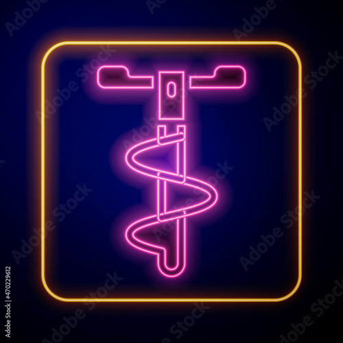 Glowing neon Hand ice drill for winter fishing icon isolated on black background. Vector