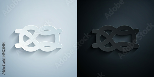 Paper cut Nautical rope knots icon isolated on grey and black background. Rope tied in a knot. Paper art style. Vector