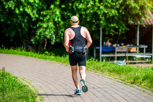 A man Jogging in a summer Park 