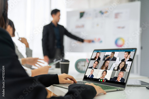Business people in video call meeting proficiently discuss business plan in office and virual workplace . Telework conference call using smart video technology to communicate colleague . photo