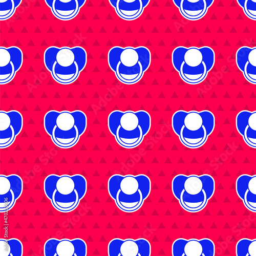 Blue Baby dummy pacifier icon isolated seamless pattern on red background. Toy of a child. Vector