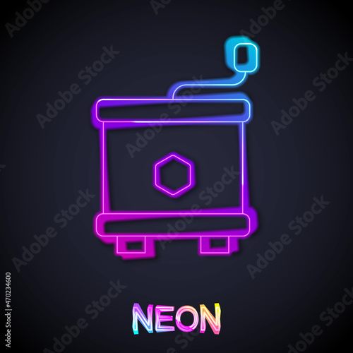 Glowing neon line Honey extractor icon isolated on black background. Mechanical device for honey extraction from honeycombs. Vector